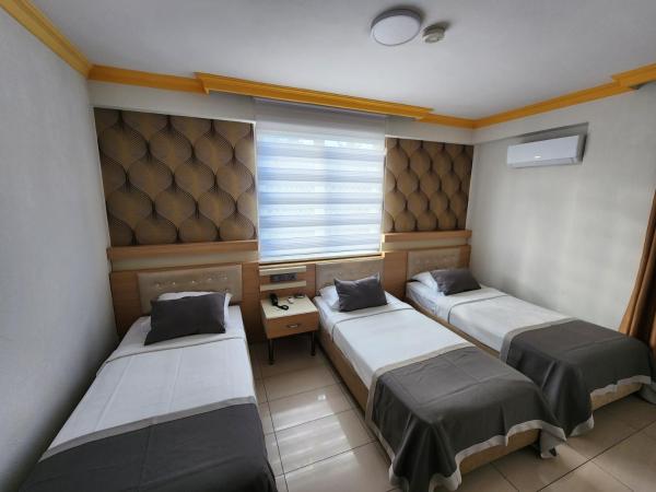 ANTALYA Konyaaltı Gündüz Otel : photo 5 de la chambre chambre triple standard