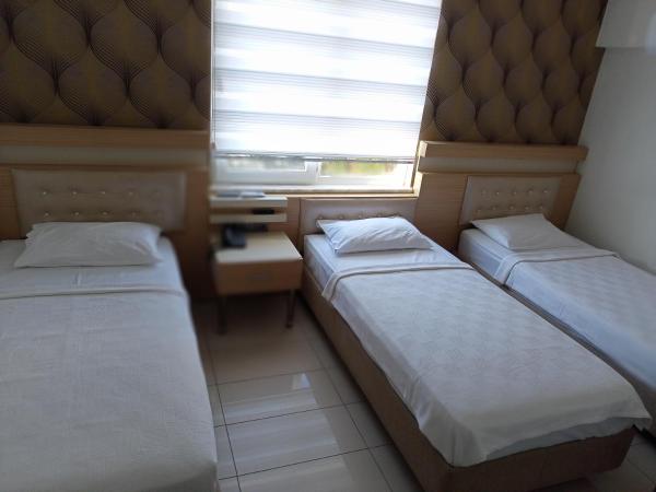 ANTALYA Konyaaltı Gündüz Otel : photo 7 de la chambre chambre triple standard