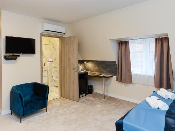 Lumen Gasztropanzió : photo 3 de la chambre chambre triple deluxe