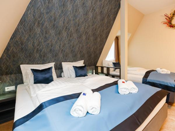 Lumen Gasztropanzió : photo 1 de la chambre chambre triple deluxe