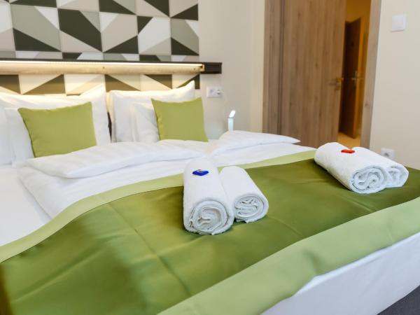 Lumen Gasztropanzió : photo 2 de la chambre chambre familiale supérieure