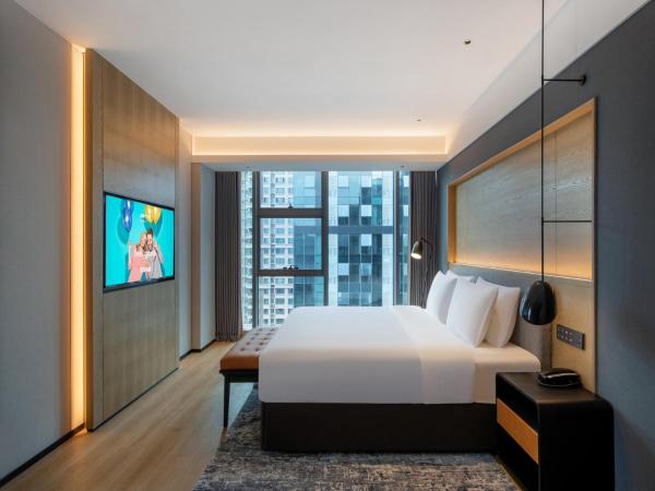 Park Inn by Radisson Chengdu Sihe Metro Station Xinchuan : photo 1 de la chambre suite avec vue