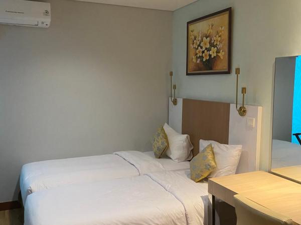 The H Tower Residence by YLS Stay : photo 5 de la chambre chambre double ou lits jumeaux supérieure avec vue sur ville