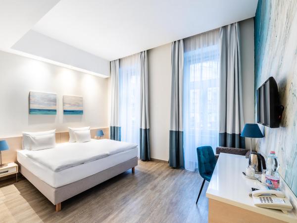 Atrium Fashion Hotel : photo 2 de la chambre chambre double ou lits jumeaux deluxe - vue sur ville