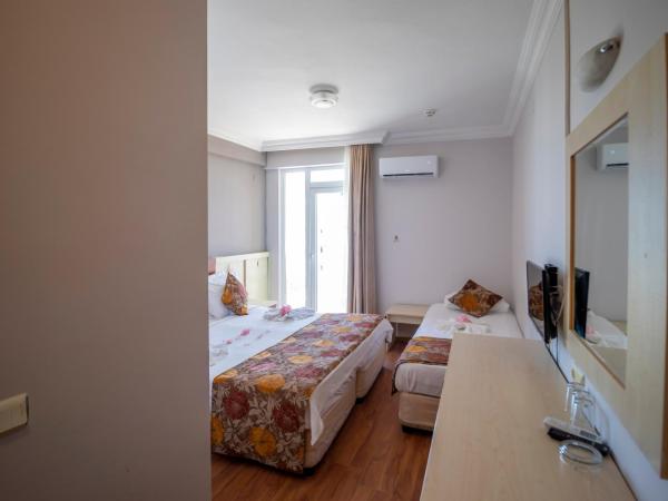 Lara Dinc Hotel : photo 3 de la chambre chambre triple standard