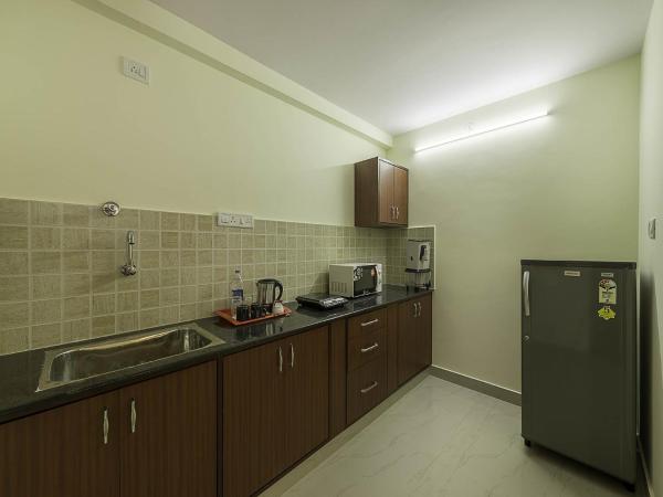 Treebo Akshaya Mayflower Vijaya Bank Layout : photo 6 de la chambre [sanitized] premium double room