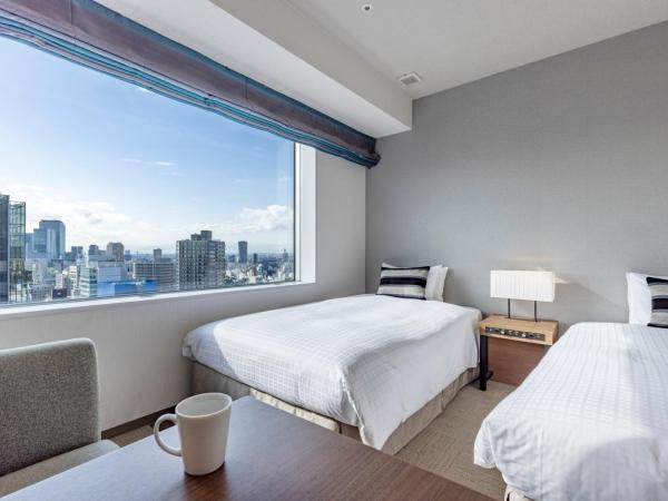 Tokyu Stay Aoyama Premier : photo 2 de la chambre chambre lits jumeaux supérieure - vue sur ville - non-fumeurs