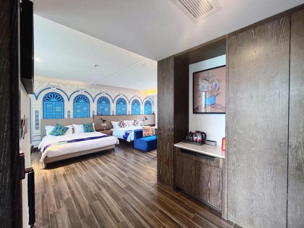 Overseas Chinese Town Nanyang Inn : photo 2 de la chambre chambre lits jumeaux exécutive