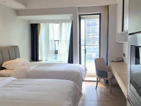 Fuan Hotel - Shenzhen International Convention and Exhibition Center Branch : photo 8 de la chambre chambre lits jumeaux deluxe