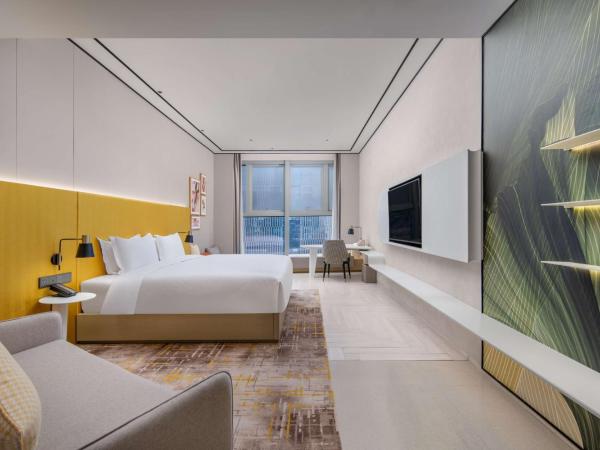 Hilton Garden Inn Nanjing Hexi Olympic Sports Center : photo 1 de la chambre chambre lit king-size premium avec canapé-lit