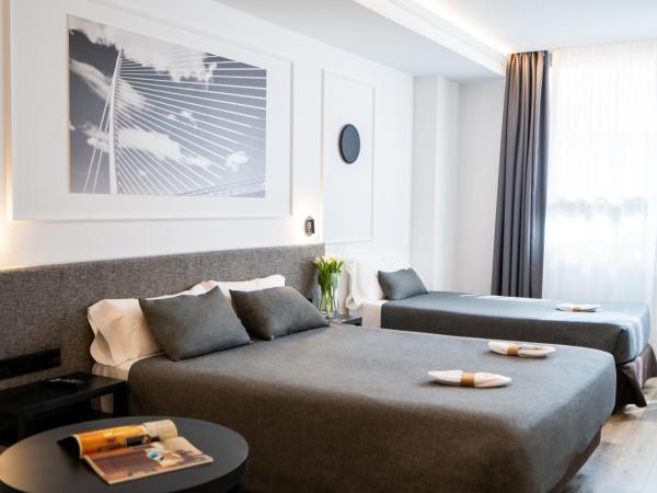 Hotel Conqueridor : photo 1 de la chambre chambre triple