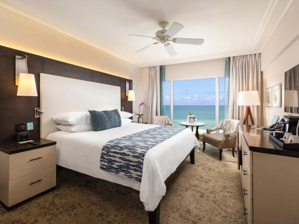 The Palms Hotel & Spa : photo 1 de la chambre hébergement avec 1 lit king-size - vue sur océan
