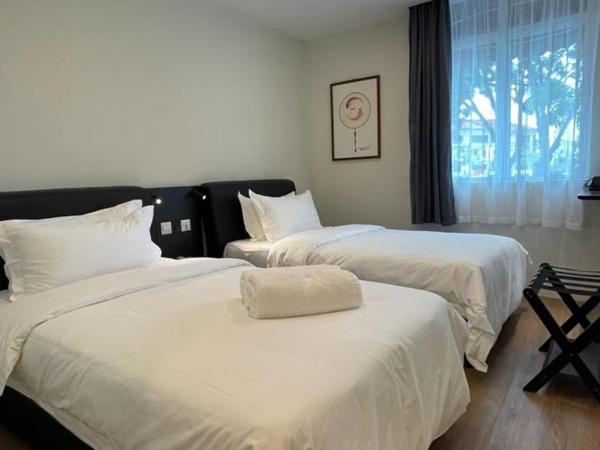 Soho Tabuan Kuching : photo 1 de la chambre chambre lits jumeaux