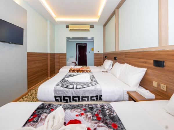 Tanha Hotel : photo 4 de la chambre chambre quadruple