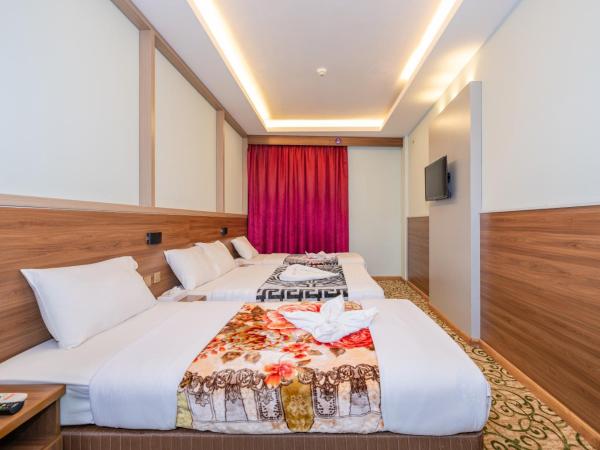 Tanha Hotel : photo 7 de la chambre chambre quadruple