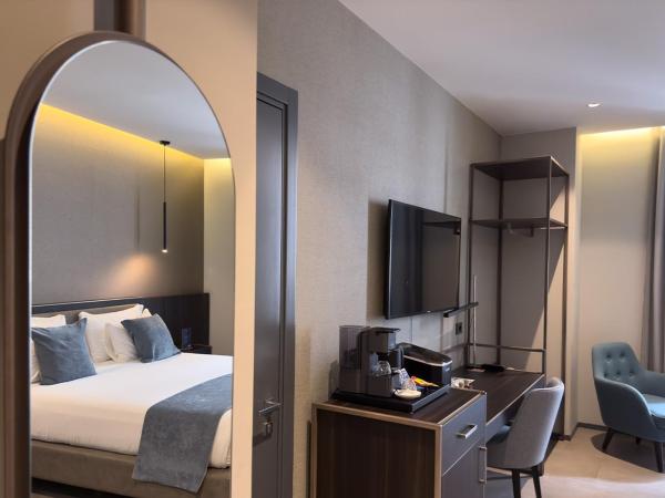 Hotel Vitruvio : photo 5 de la chambre chambre triple deluxe