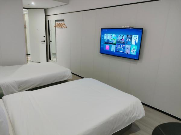 Shanghai Ange Hotel - Next to Longyang Road Subway Station, Near New Internatonal Expo Center : photo 3 de la chambre chambre lits jumeaux supérieure