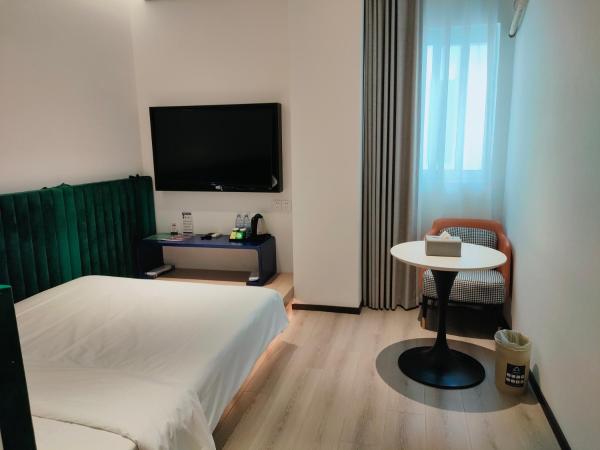 Shanghai Ange Hotel - Next to Longyang Road Subway Station, Near New Internatonal Expo Center : photo 3 de la chambre chambre supérieure lit queen-size