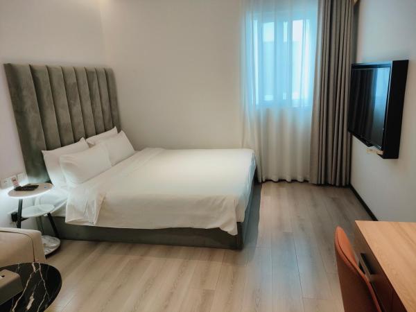 Shanghai Ange Hotel - Next to Longyang Road Subway Station, Near New Internatonal Expo Center : photo 7 de la chambre chambre lit queen-size deluxe