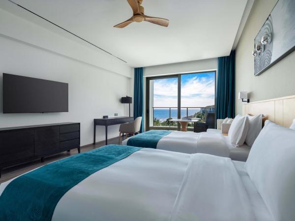 Sanya Junji Seaview Hotel : photo 1 de la chambre chambre lits jumeaux de luxe - vue sur mer 


