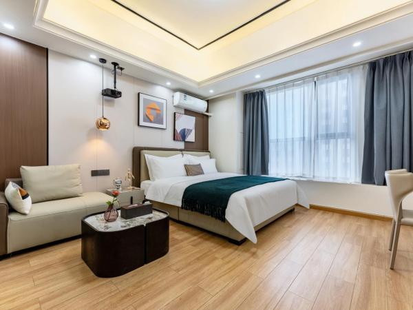 East Maple International Apartment - Guangzhou Luogang Wanda Plaza Suyuan Metro Station : photo 7 de la chambre chambre lit queen-size deluxe