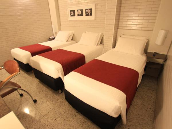Hotel Confiance Batel : photo 2 de la chambre chambre triple de luxe avec 3 lits simples 