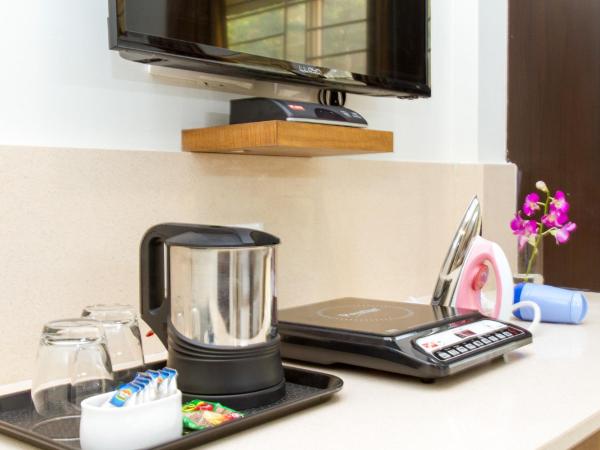 Sanctum Suites Whitefield Bangalore : photo 10 de la chambre chambre supérieure lit queen-size