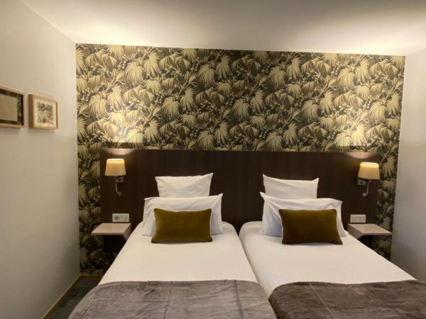 Cit'Hotel Hôtel de France et d'Europe : photo 2 de la chambre chambre lits jumeaux avec baignoire