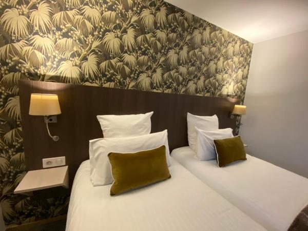 Cit'Hotel Hôtel de France et d'Europe : photo 4 de la chambre chambre lits jumeaux avec baignoire