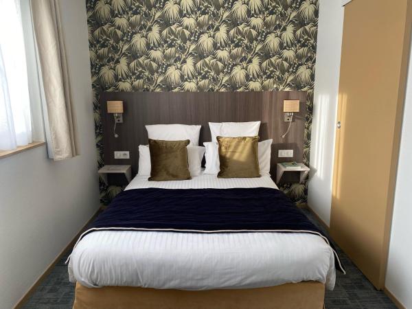 Cit'Hotel Hôtel de France et d'Europe : photo 2 de la chambre chambre triple (1 lit double et 1 lit simple)