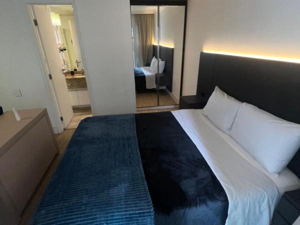 HOTEL PERDIZES - FLAT Executivo - 504 : photo 6 de la chambre chambre double deluxe (2 adultes + 1 enfant)