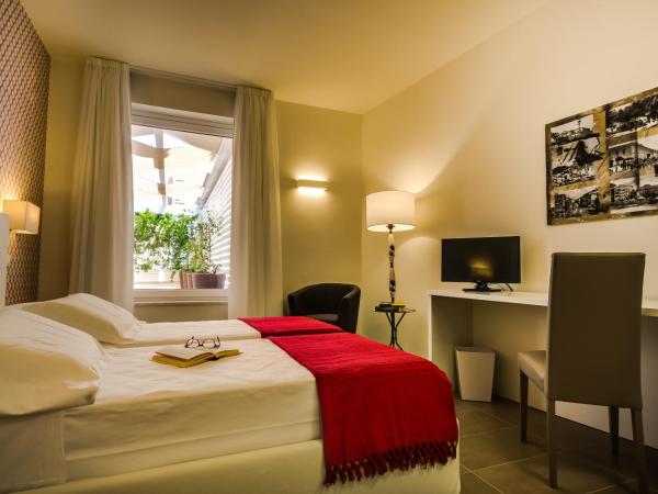 Il Gallo Bianco : photo 1 de la chambre chambre lits jumeaux