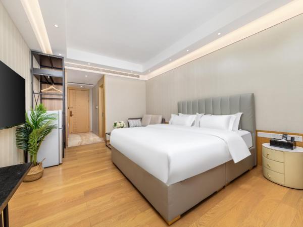 Doria Home International Apartment -Guangzhou Huijin IFC Keyun Road Metro Branch-Canton Fair Free Shuttle : photo 4 de la chambre chambre lit queen-size deluxe