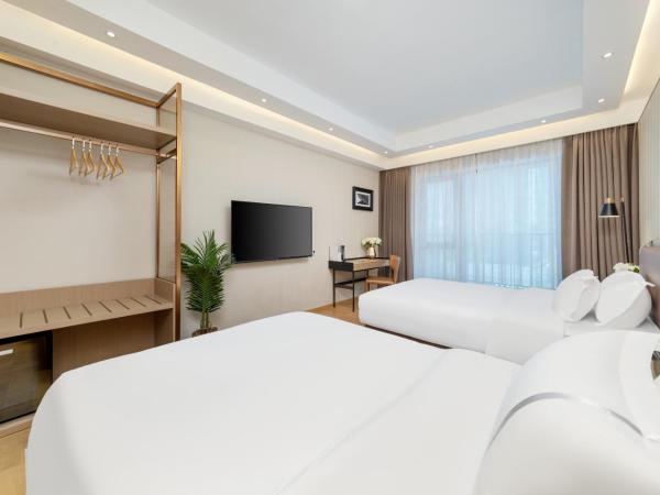 Doria Home International Apartment -Guangzhou Huijin IFC Keyun Road Metro Branch-Canton Fair Free Shuttle : photo 3 de la chambre chambre lits jumeaux deluxe