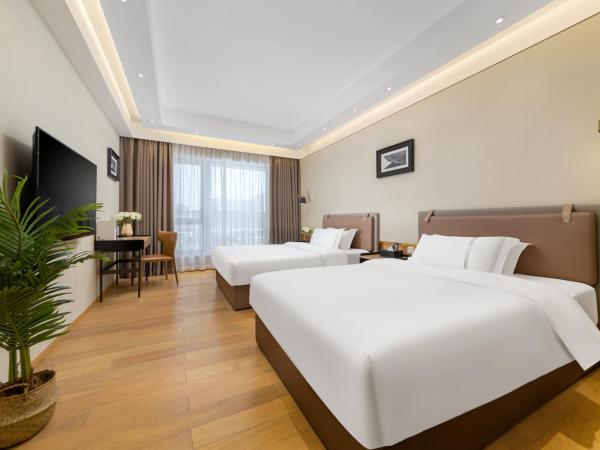 Doria Home International Apartment -Guangzhou Huijin IFC Keyun Road Metro Branch-Canton Fair Free Shuttle : photo 1 de la chambre chambre lits jumeaux deluxe
