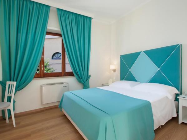 Hotel Regina : photo 2 de la chambre chambre quadruple avec jardin privé