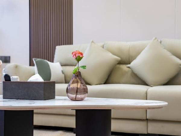 East Maple International Apartment - Guangzhou Luogang Wanda Plaza Suyuan Metro Station : photo 9 de la chambre chambre lit queen-size deluxe