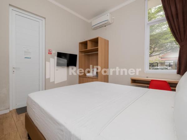 Palm Eight Mitra RedDoorz : photo 5 de la chambre chambre double deluxe