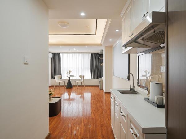 East Maple International Apartment - Guangzhou Luogang Wanda Plaza Suyuan Metro Station : photo 2 de la chambre appartement 2 chambres