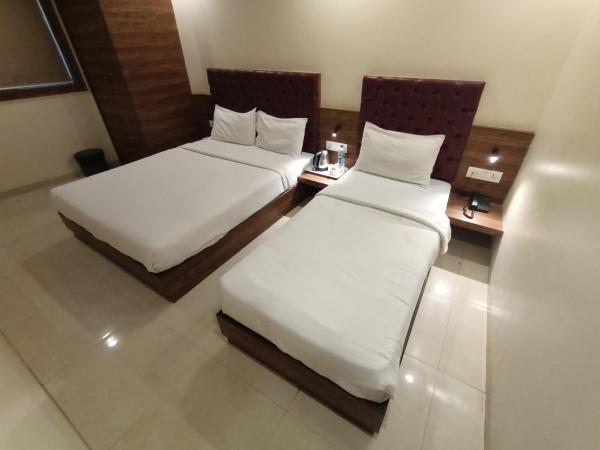Hotel New Peninsula Suite - Near Masjid Bandar and CST Station - South Mumbai : photo 5 de la chambre chambre triple deluxe