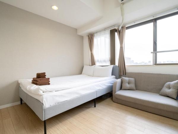 Nishinippori Guest House : photo 2 de la chambre chambre double ou lits jumeaux avec salle de bains privative