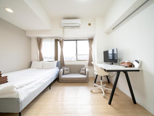 Nishinippori Guest House : photo 1 de la chambre chambre double ou lits jumeaux avec salle de bains privative