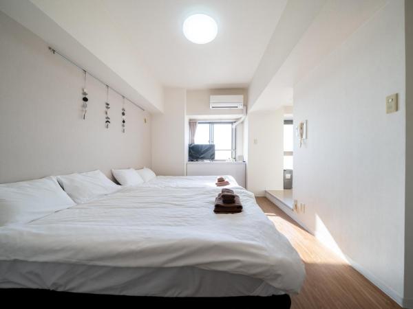 Nishinippori Guest House : photo 4 de la chambre chambre quadruple avec salle de bains privative
