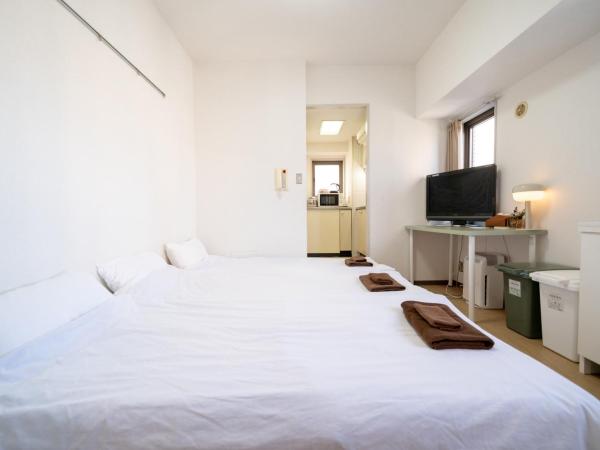 Nishinippori Guest House : photo 1 de la chambre chambre triple avec salle de bains privative