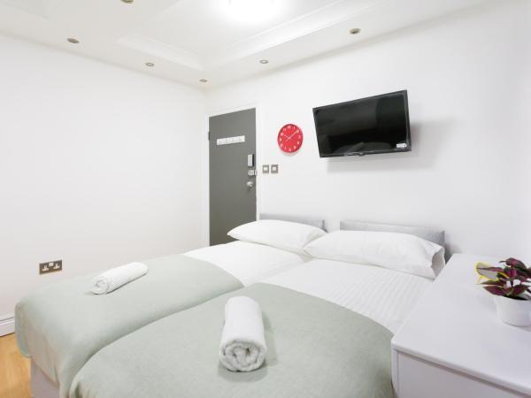 Eurostar Budget Rooms - Next to Kings Cross & Eurostar Train Station : photo 4 de la chambre chambre triple