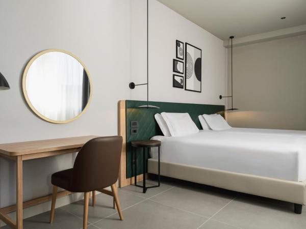 Hilton Garden Inn Bologna North : photo 4 de la chambre chambre lits jumeaux avec canapé-lit