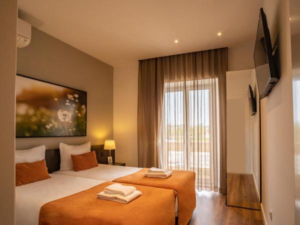 Riversuites : photo 6 de la chambre chambre lits jumeaux basique