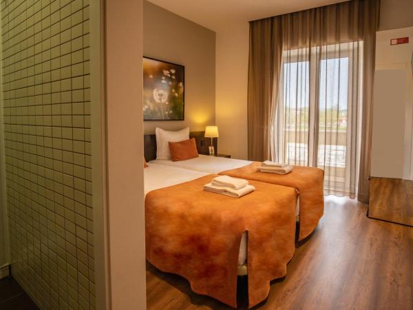 Riversuites : photo 5 de la chambre chambre lits jumeaux basique