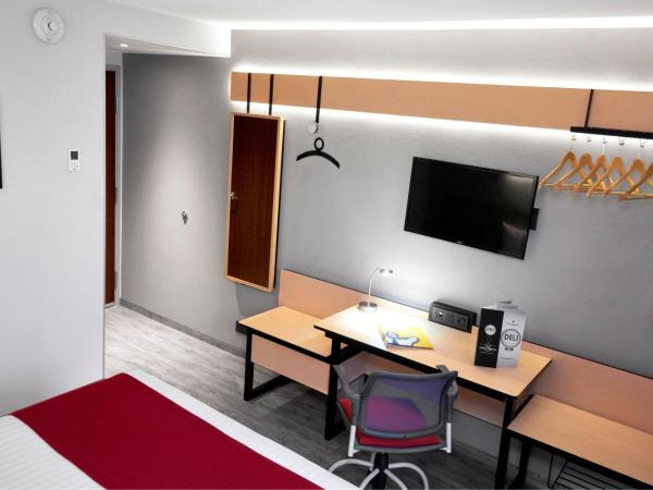 City Express by Marriott Mérida : photo 4 de la chambre chambre lit queen-size 