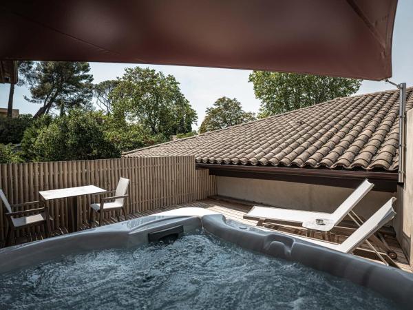 Hôtel Le Parc - La Table de Franck Putelat : photo 2 de la chambre chambre double de luxe avec jacuzzi extérieur